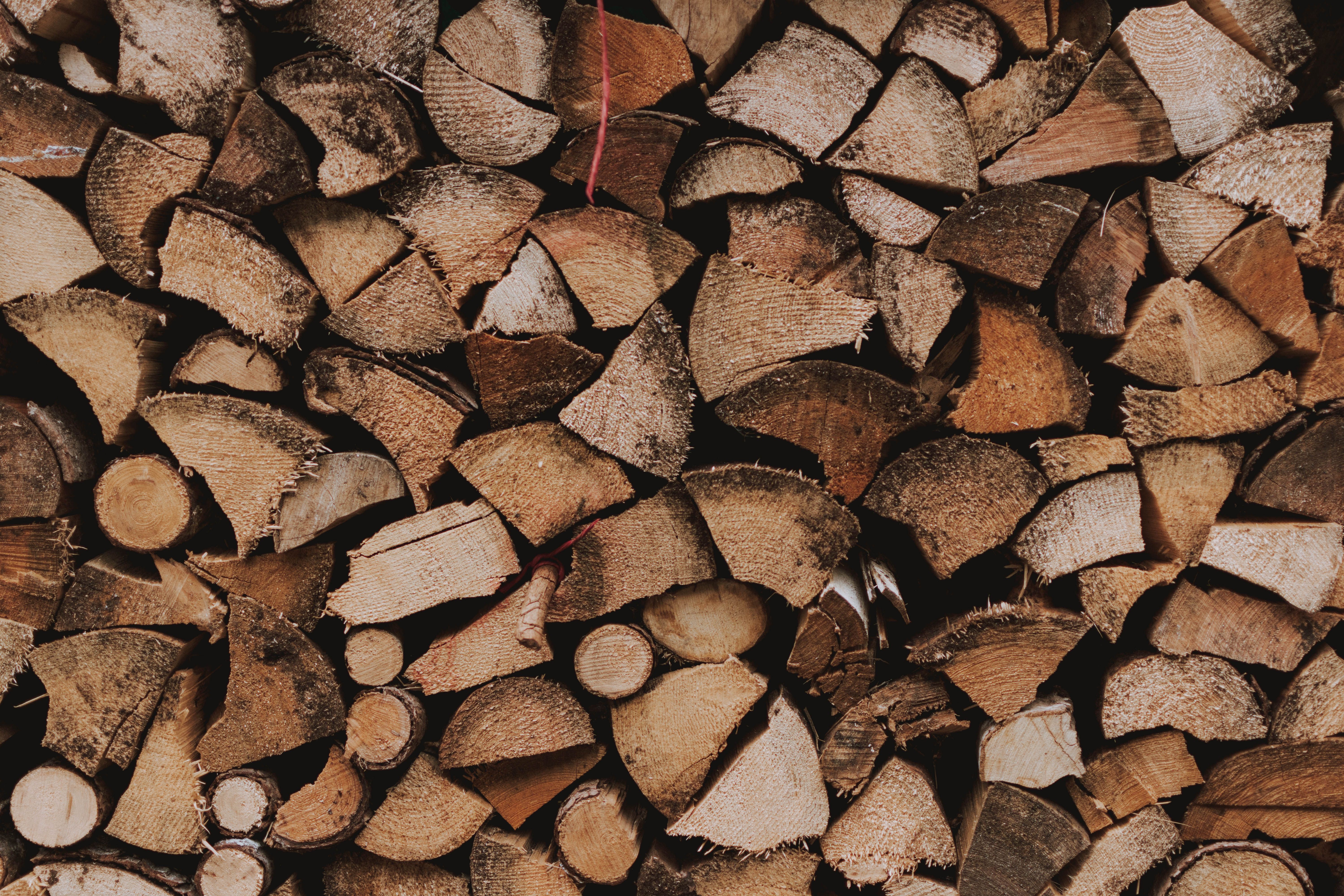 Close-up of split firewood stacked tight in a woodpile